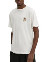 Carica l&#39;immagine nel visualizzatore di Gallery, T-SHIRT TOMMY HILFIGER CON LOGO LATO CUORE CON CORONA DI ALLORO ORO CUCITA