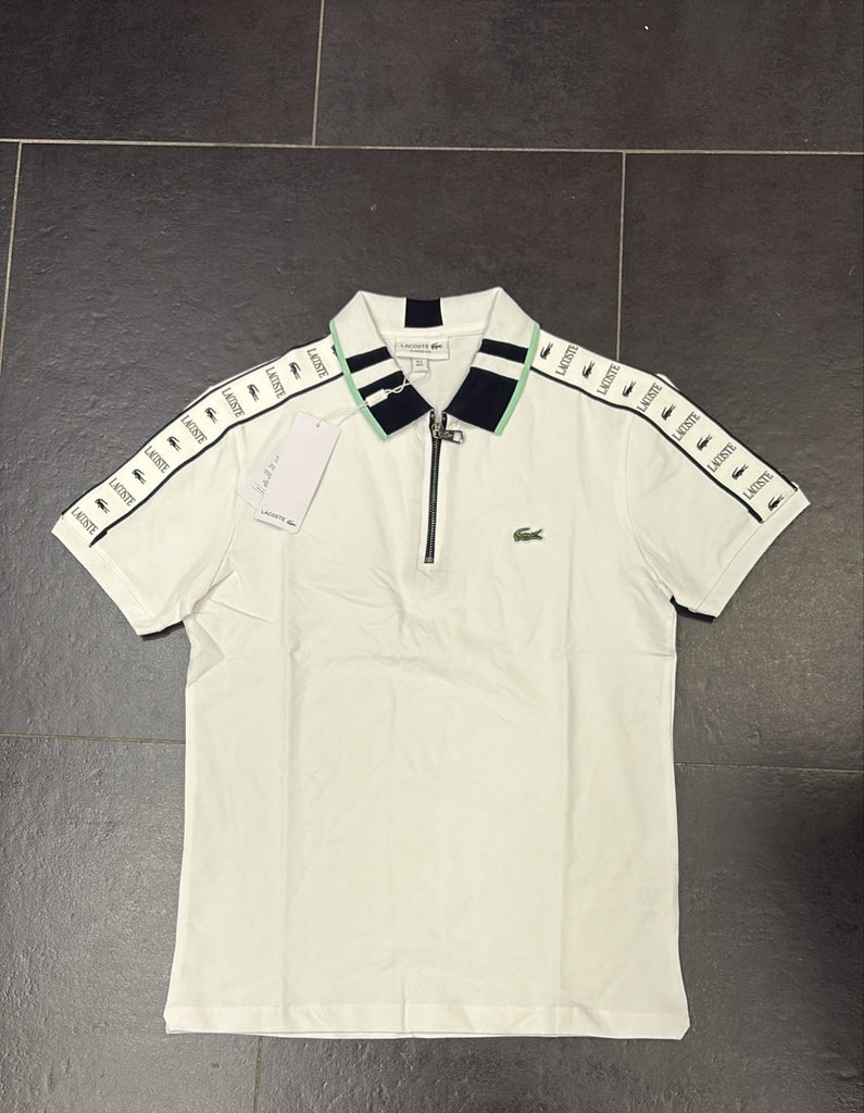 POLO LACOSTE CON COLLETTO VERDE E LOGO MANICA